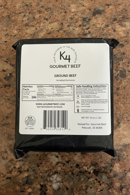 Black package of Ground Beef (80/20) on a speckled countertop